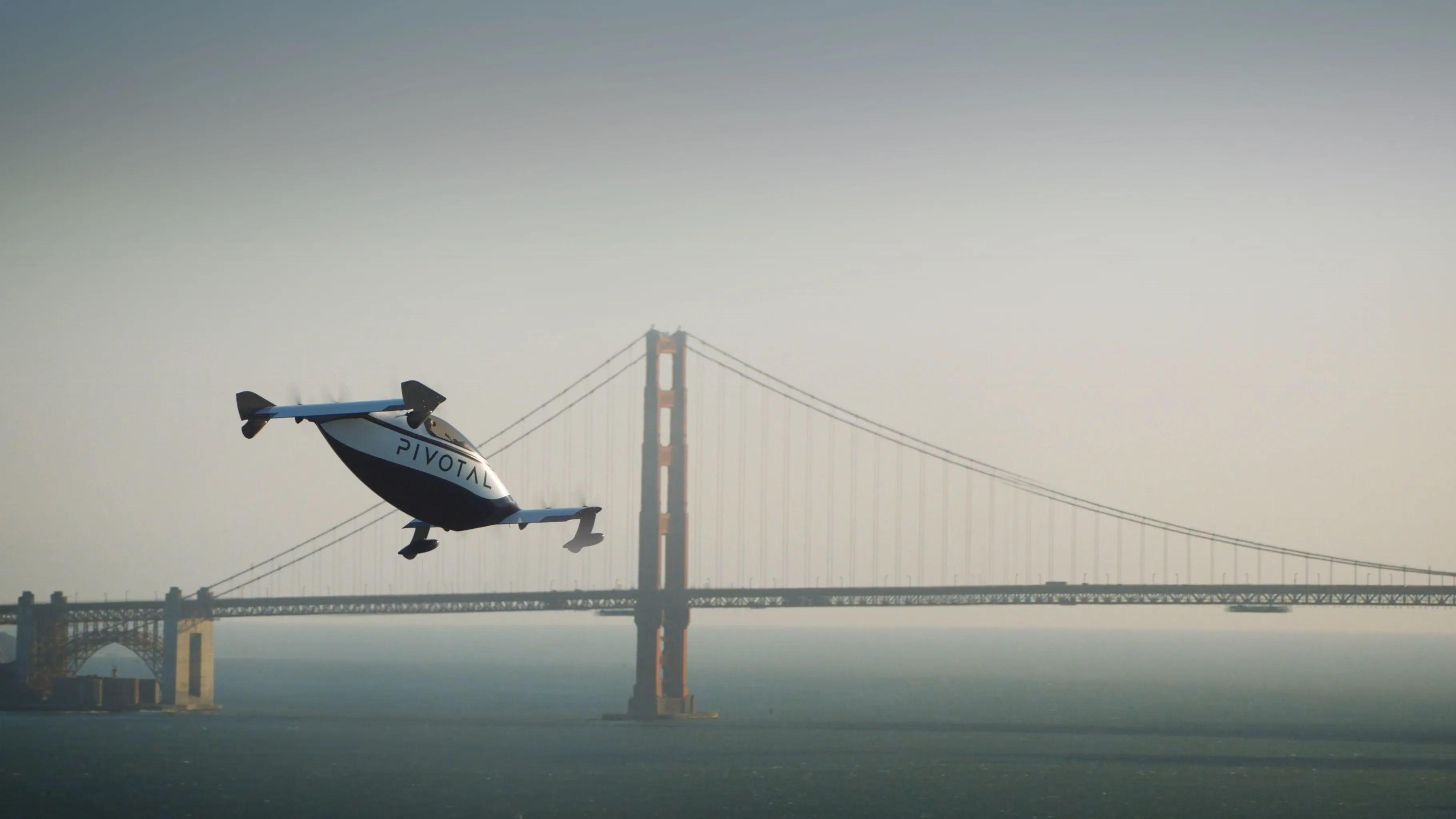 Pivotal Helix aircraft flying next to the Golden Gate Bridge in San Francisco, California.